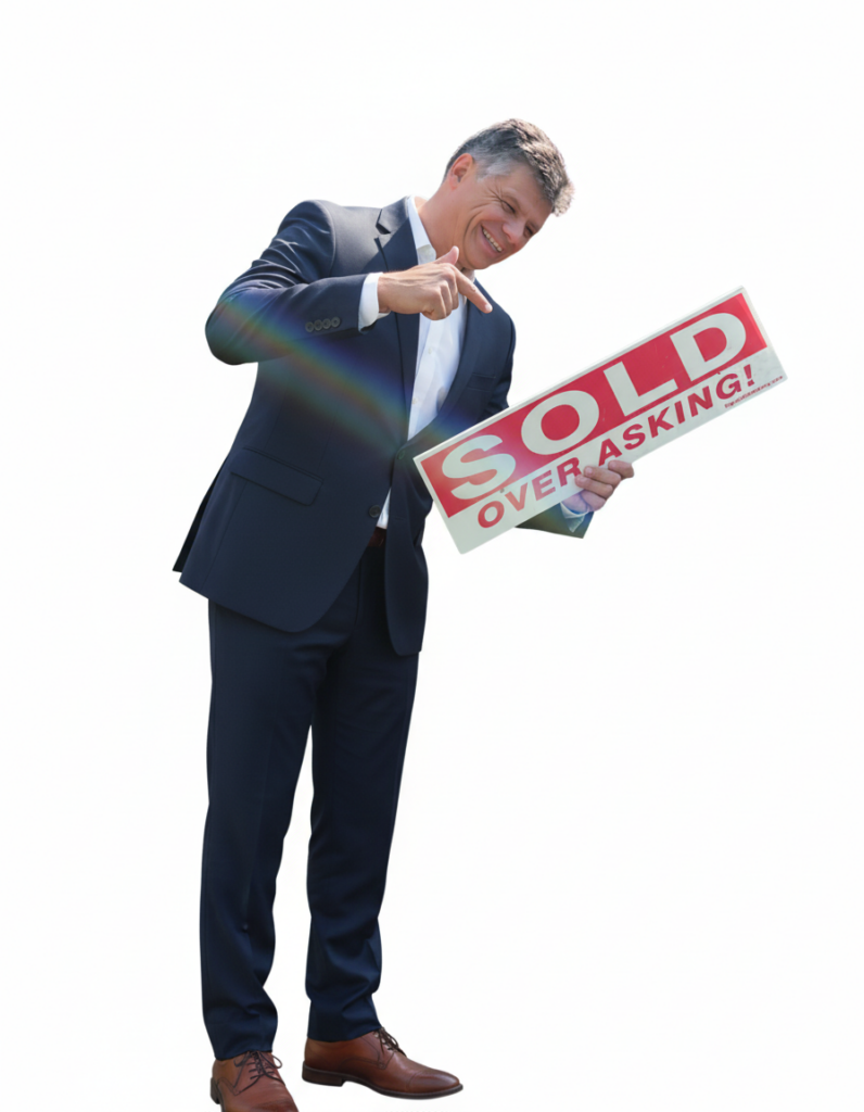 Top Etobicoke Realtor holding a sold sign.
